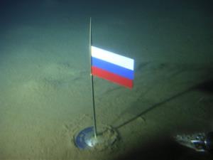 In this Thursday, Aug. 2, 2007, photo, a titanium capsule with the Russian flag is seen seconds after it was planted by the Mir-1 mini submarine on the Arctic Ocean seabed under the North Pole.