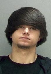 This undated photo provided by the Salt Lake County Jail shows Cody Jackson.