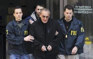 In this Jan. 23, 2014, file photo, FBI agents escort reputed mobster Vincent Asaro, center, from FBI offices in New York's lower Manhattan.