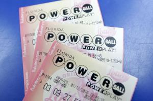 Purchased Powerball lottery tickets are shown Tuesday, Jan. 12, 2016, in Miami.