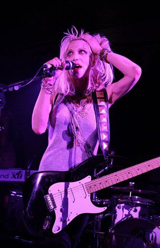 guitar hero 5 uses cobains image illegally: love